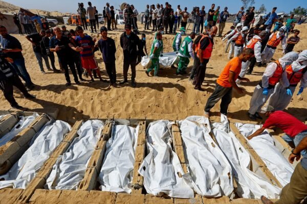 A mass funeral was held in Gaza for the remains of Palestinian prisoners returned by Israel as Palestinian officials allege signs of torture.