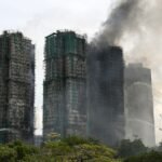 Hong Kong fire death toll rises to 128, officials say