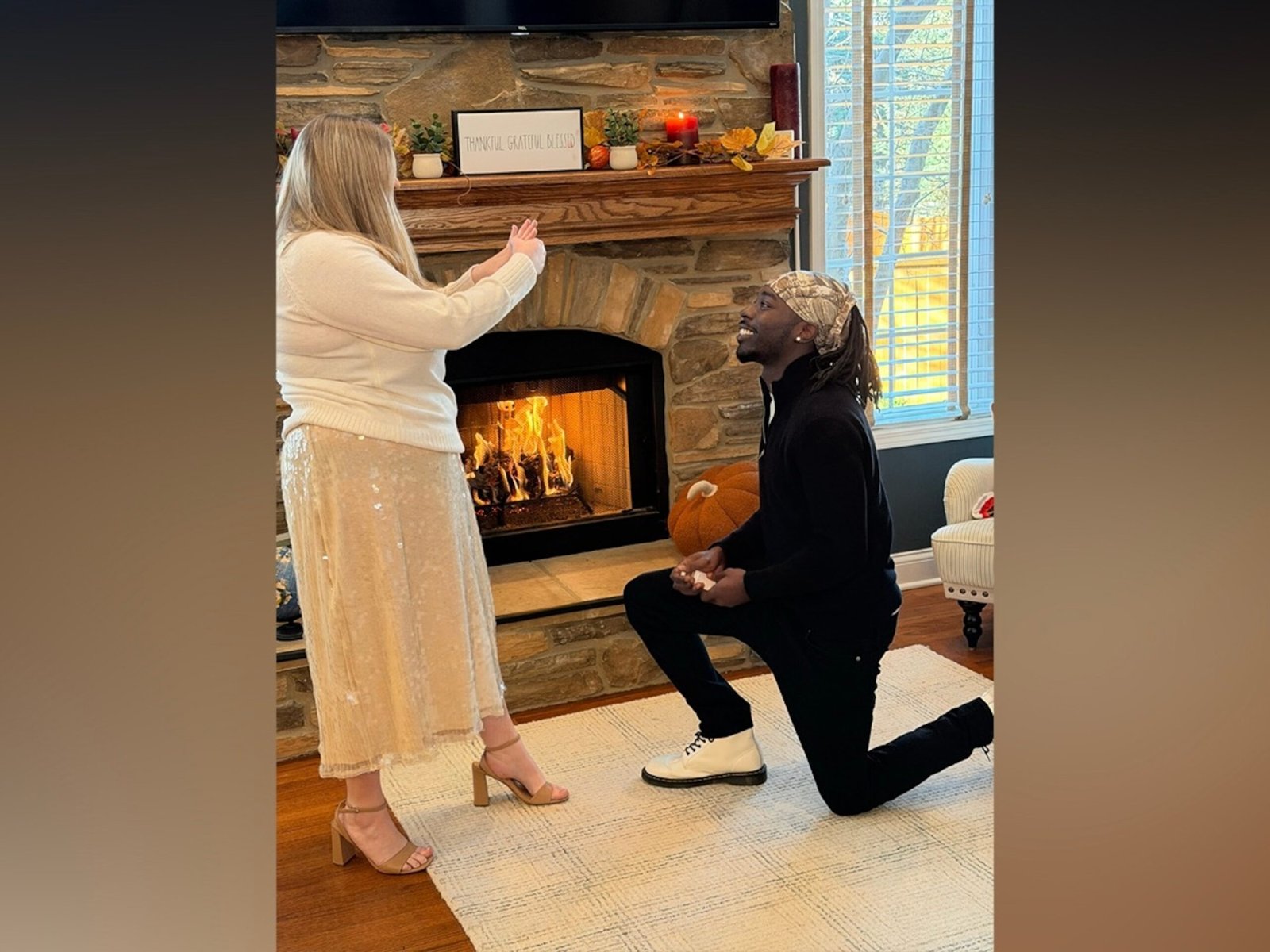 The family celebrates the second Thanksgiving dinner with the mailman who came to the father's aid